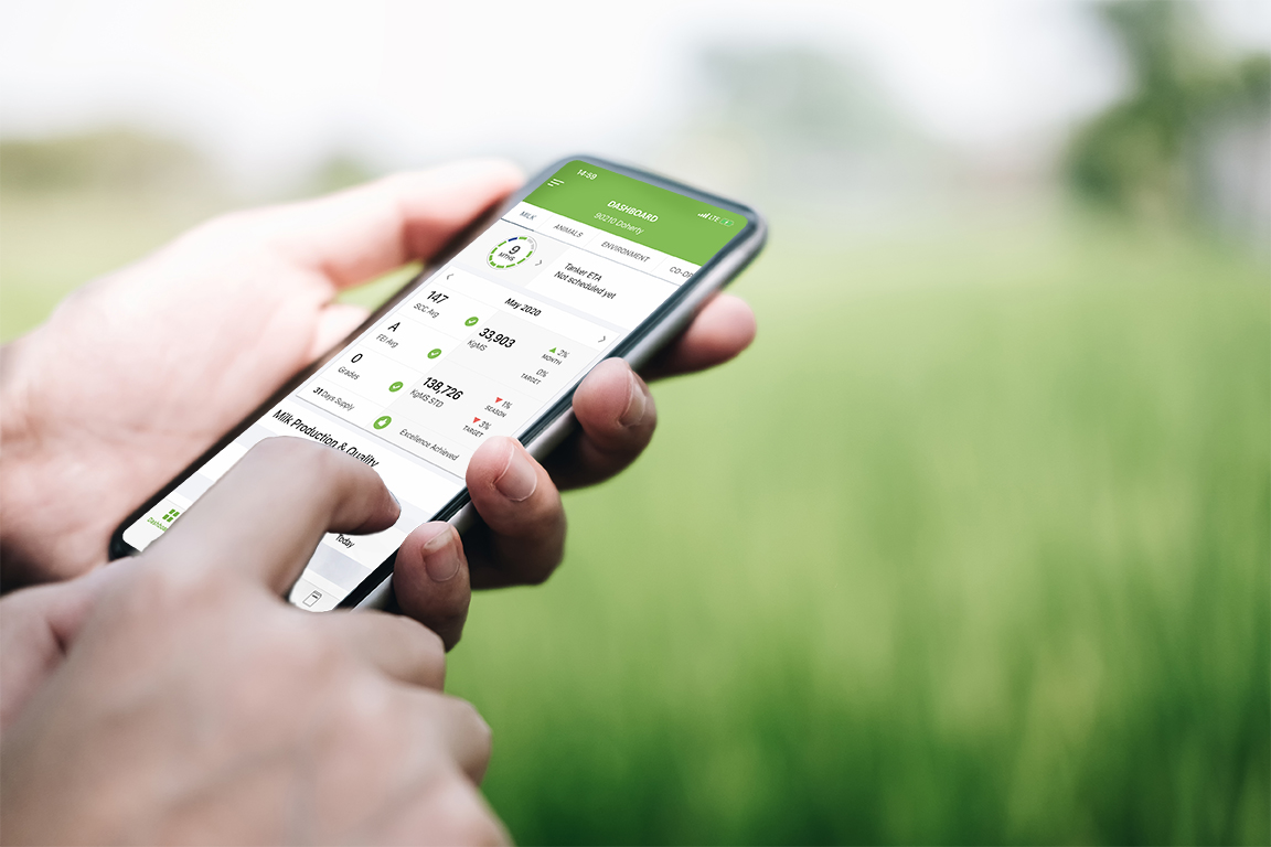 Farmer entering data using mobile phone